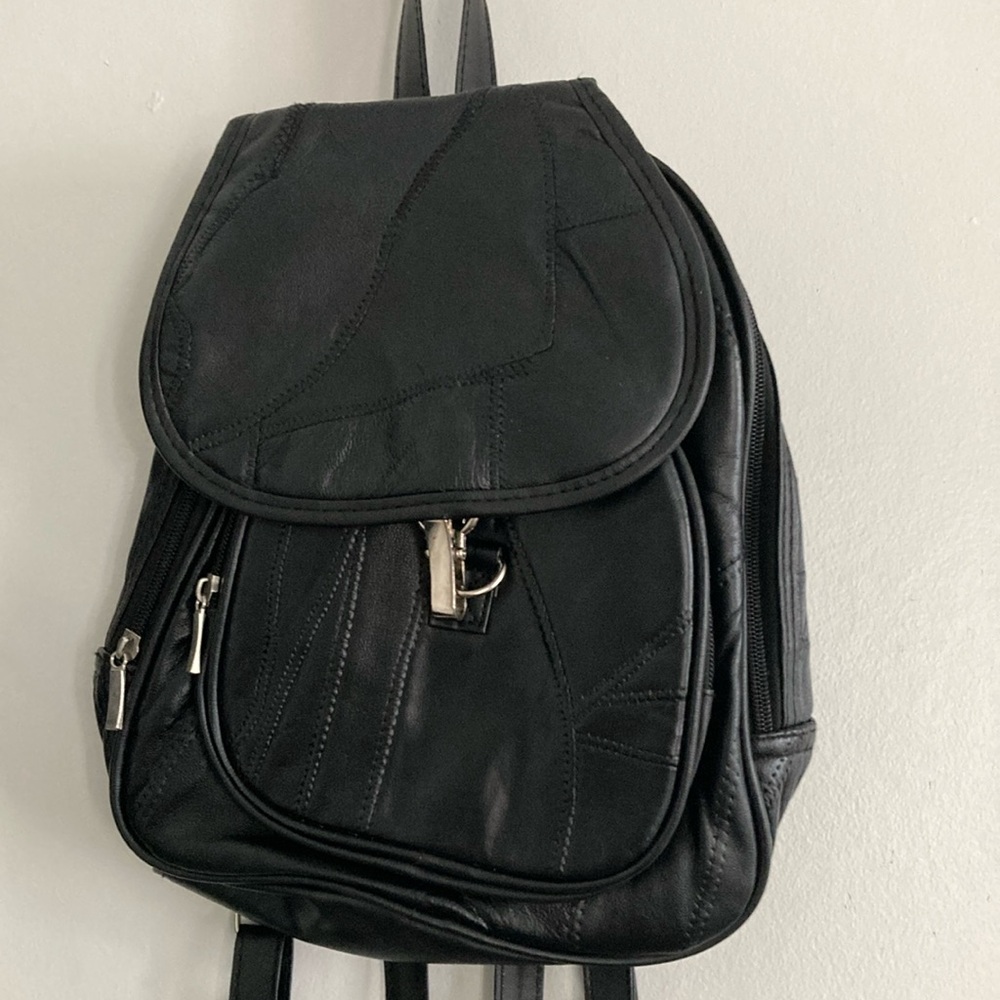 Black zippered backpack purse
